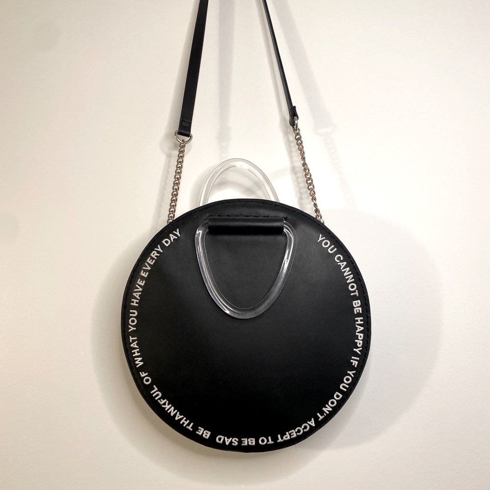 circular embroidered faux leather bag